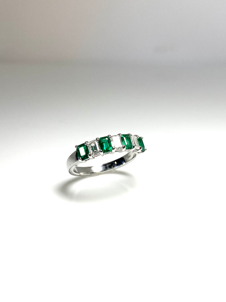 PLATINUM DIAMOND AND EMERALD ETERNITY BAND