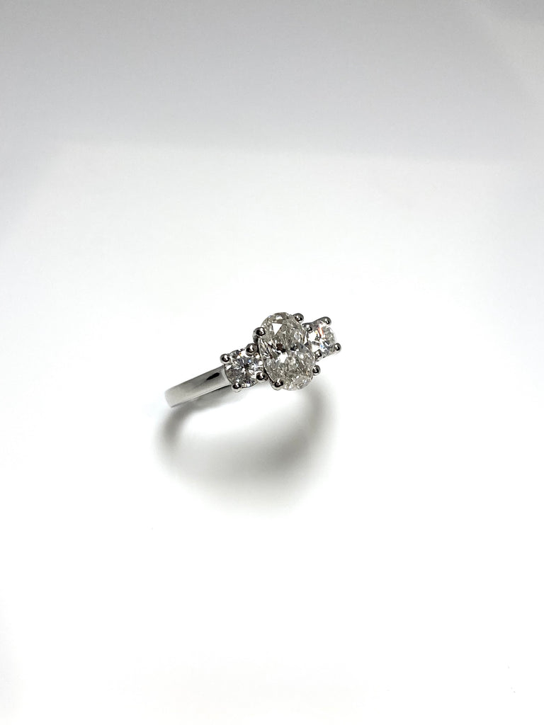 PLATINUM 1.50CT OVAL DIAMOND TRILOGY RING