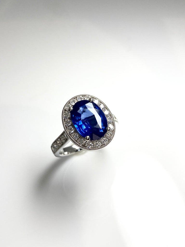 3.40CT SRI LANKAN SAPPHIRE WITH A 73PT DIAMOND HALO SET IN PLATINUM