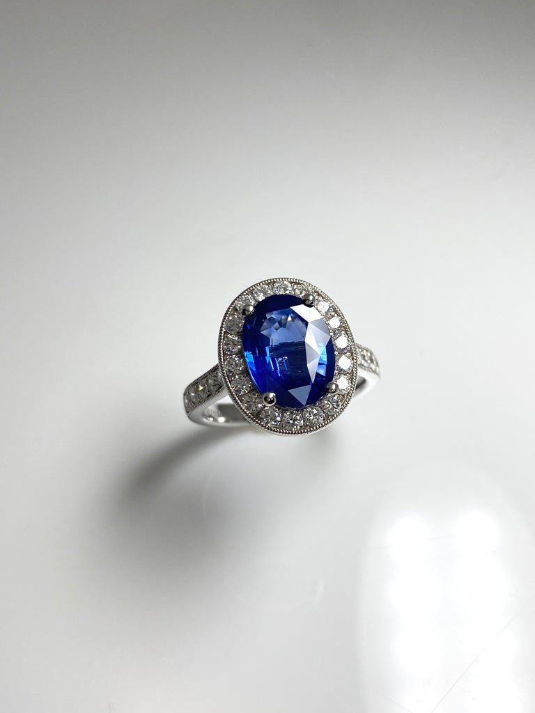 3.40CT SRI LANKAN SAPPHIRE WITH A 73PT DIAMOND HALO SET IN PLATINUM