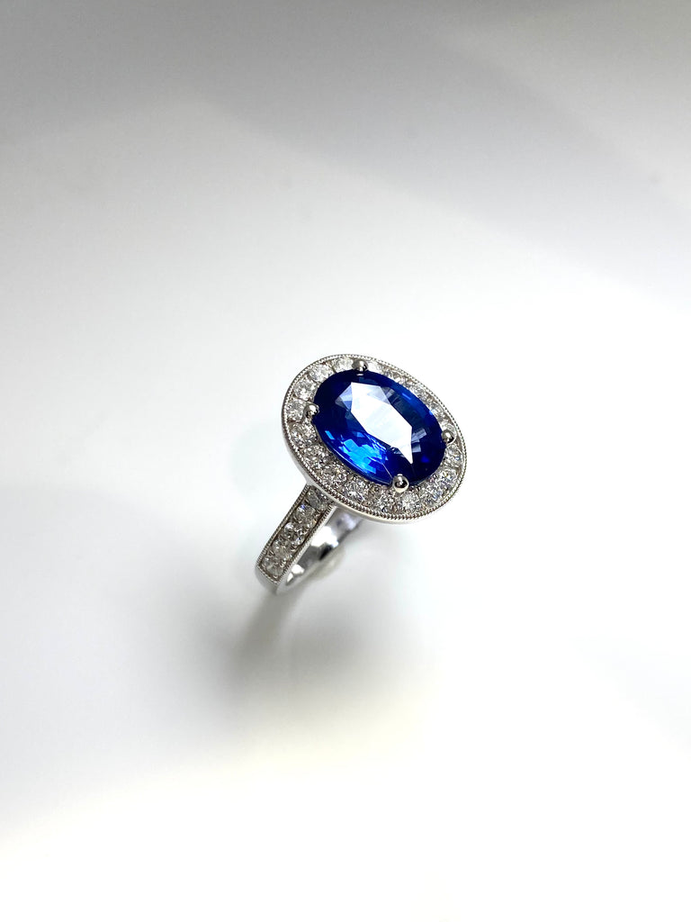 3.40CT SRI LANKAN SAPPHIRE WITH A 73PT DIAMOND HALO SET IN PLATINUM