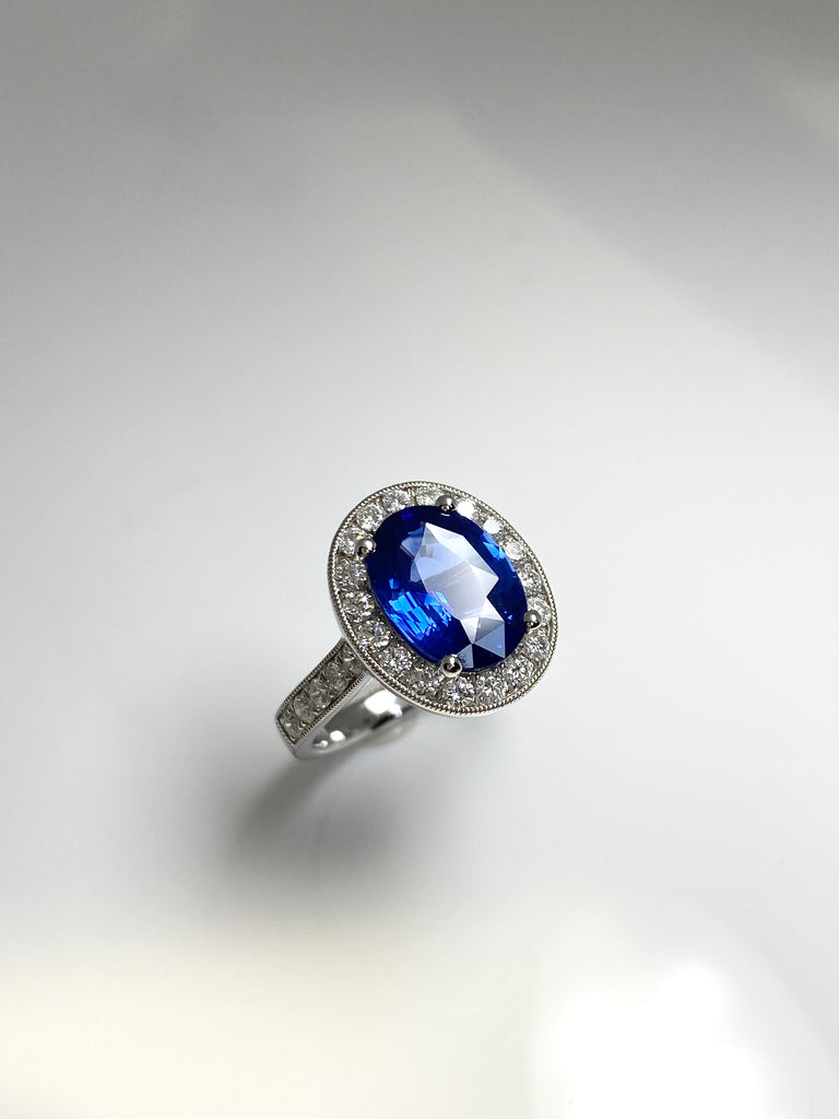 3.40CT SRI LANKAN SAPPHIRE WITH A 73PT DIAMOND HALO SET IN PLATINUM