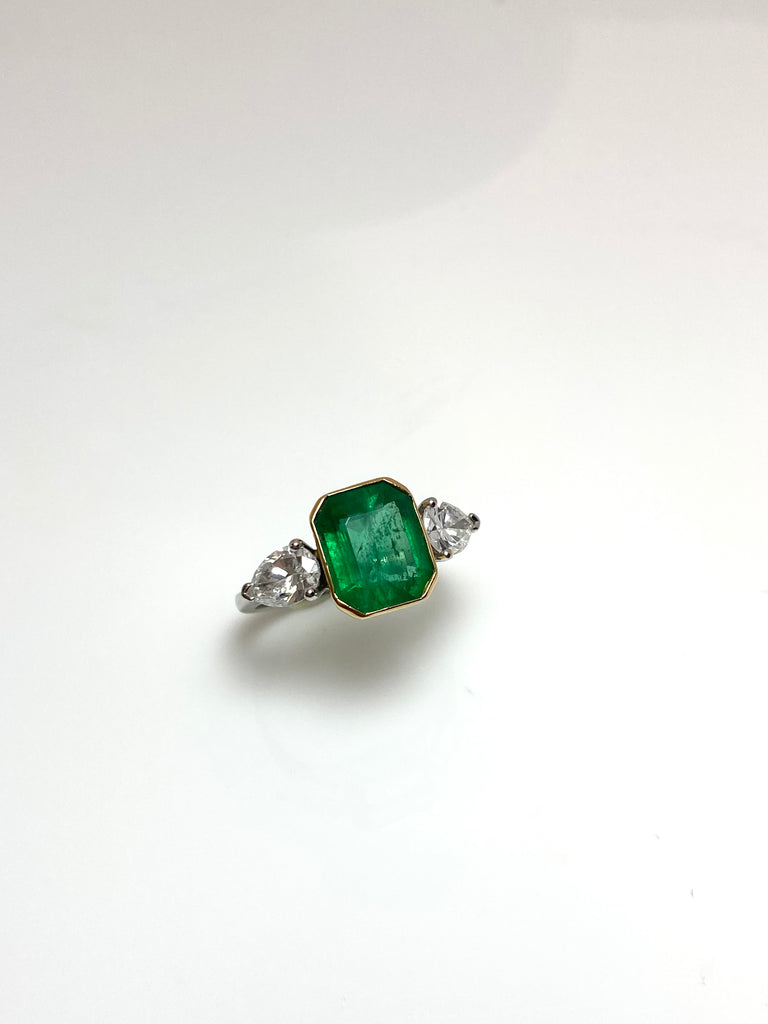 PLATINUM 3.28CT EMERALD WITH PEAR SHAPED DIAMONDS TRILOGY RING