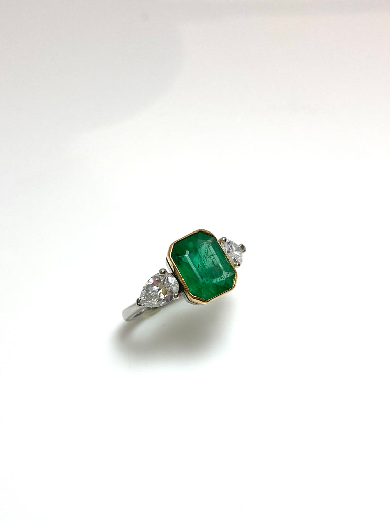 PLATINUM 3.28CT EMERALD WITH PEAR SHAPED DIAMONDS TRILOGY RING