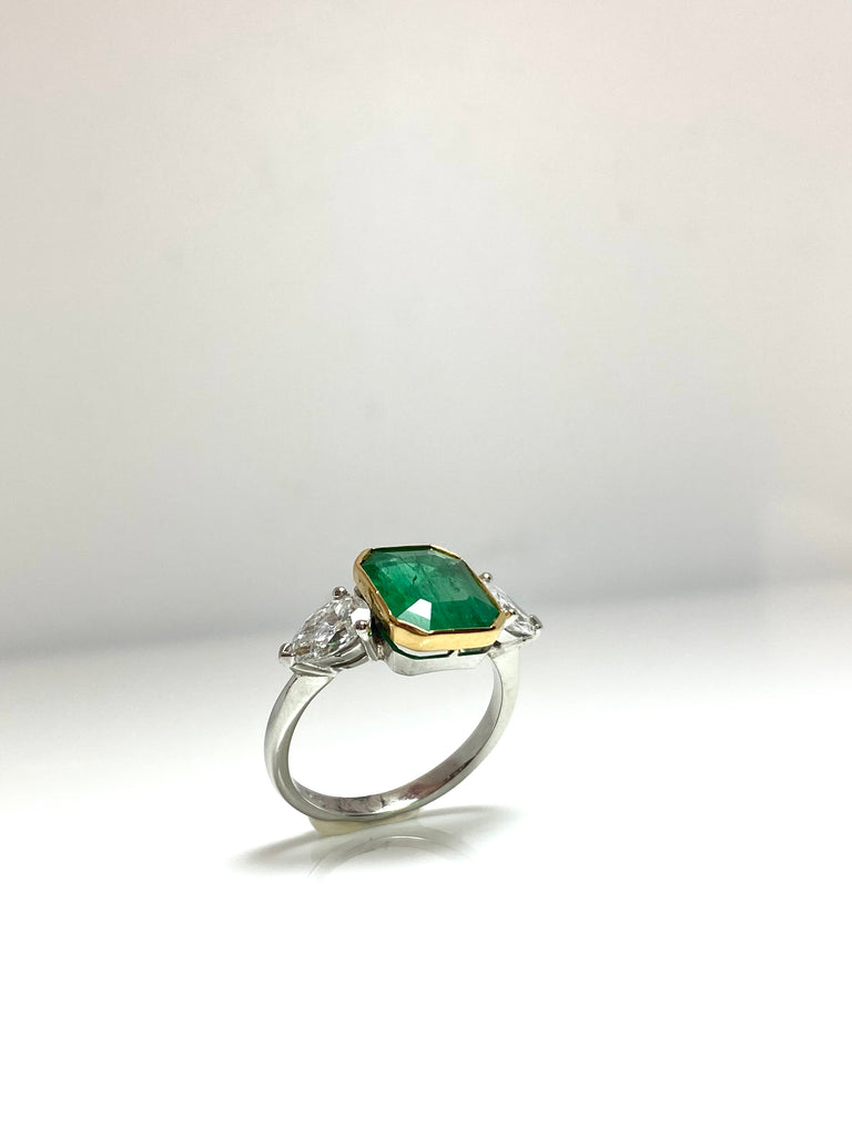 PLATINUM 3.28CT EMERALD WITH PEAR SHAPED DIAMONDS TRILOGY RING